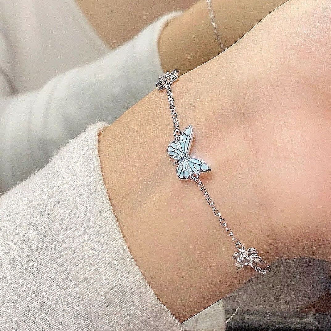 Butterfly chain bracelet worn on a wrist, not included