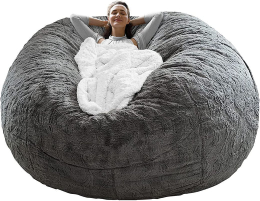 Dark grey bean bag chair cover empty and unfilled flat on the floor