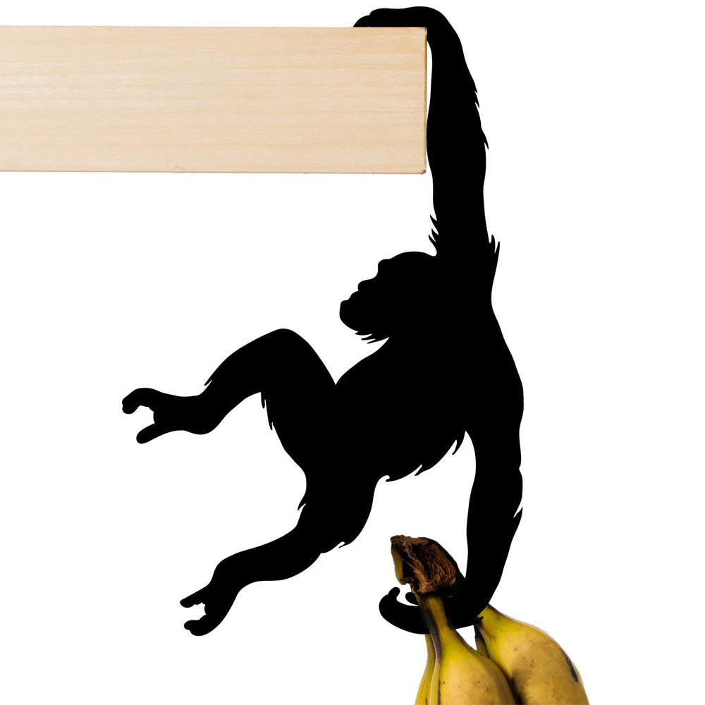 Black hanging monkey wall hook gripping a shelf edge and holding bananas