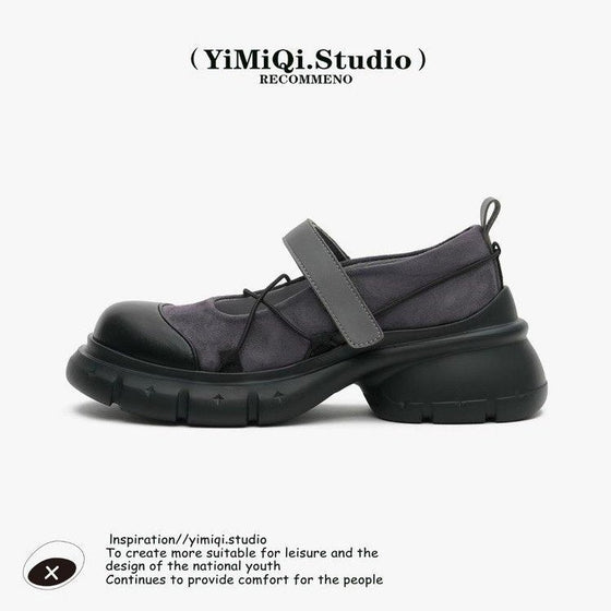 Black platform Mary Jane shoe with a strap, side view