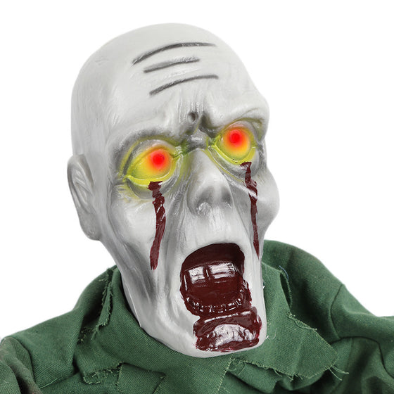 Close-up of a zombie prop head with glowing red eyes