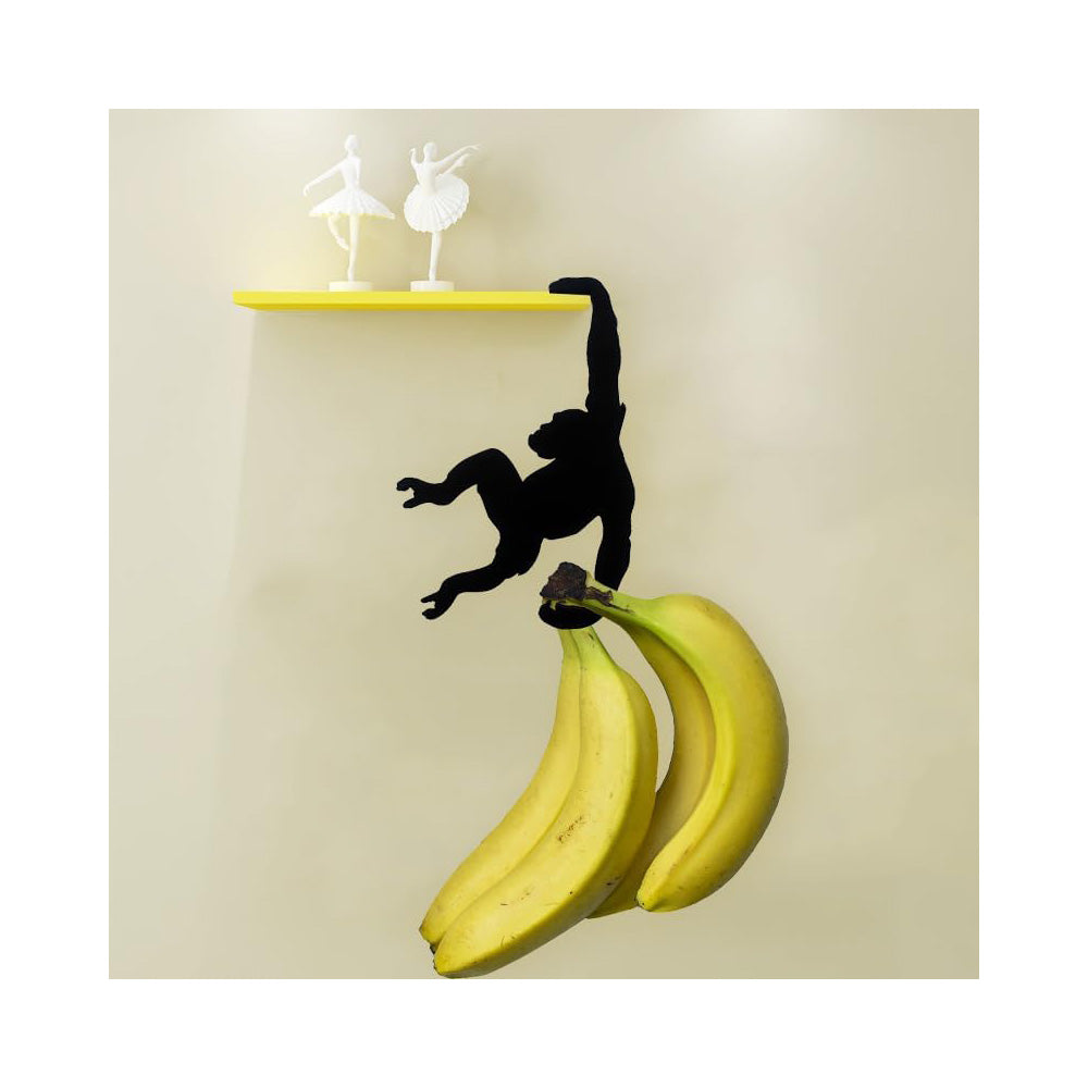 Monkey silhouette hook under a yellow shelf holding bananas