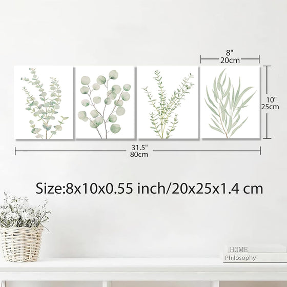 Botanical canvas set displayed above a bathroom sink