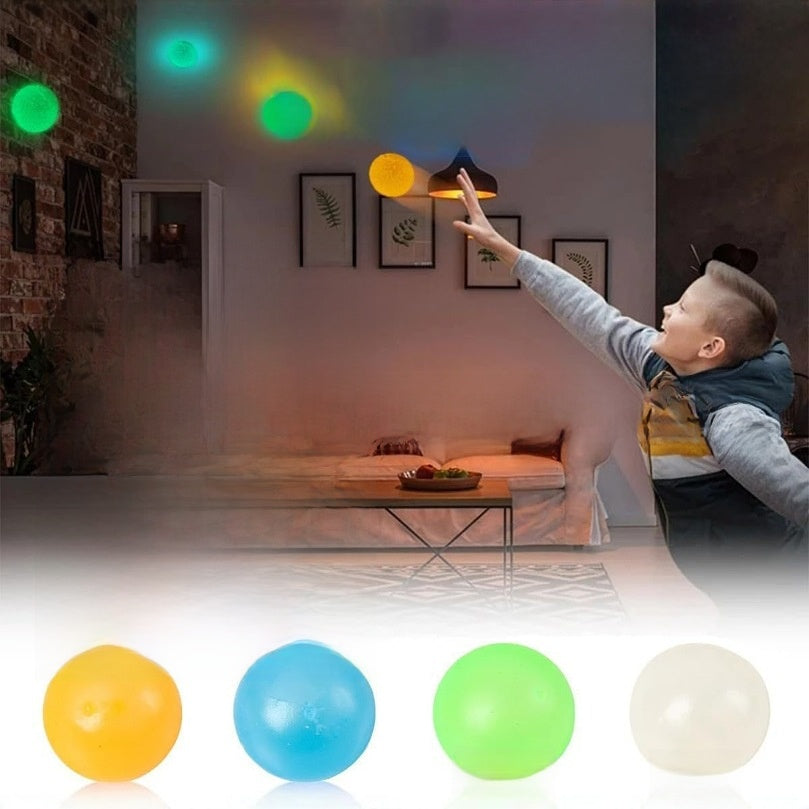 Glow-in-the-dark sticky squeeze balls stuck to a ceiling, photo 2