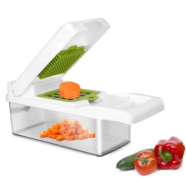 Slicer dicer in use chopping vegetables on a cutting board