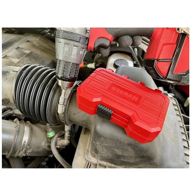 Red bit case resting in a car engine bay