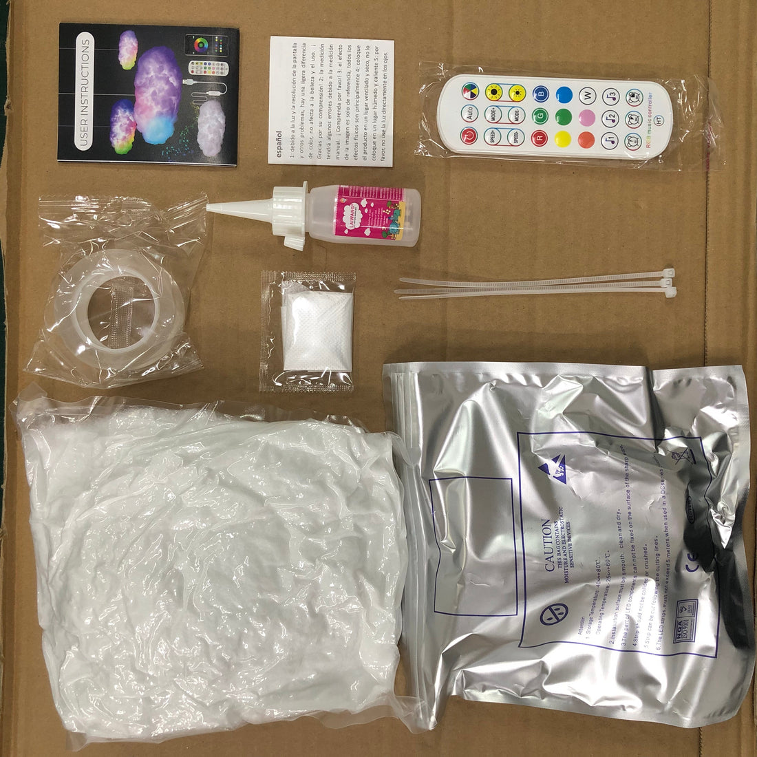Cloud lamp kit contents: filling, LED strip, remote and glue