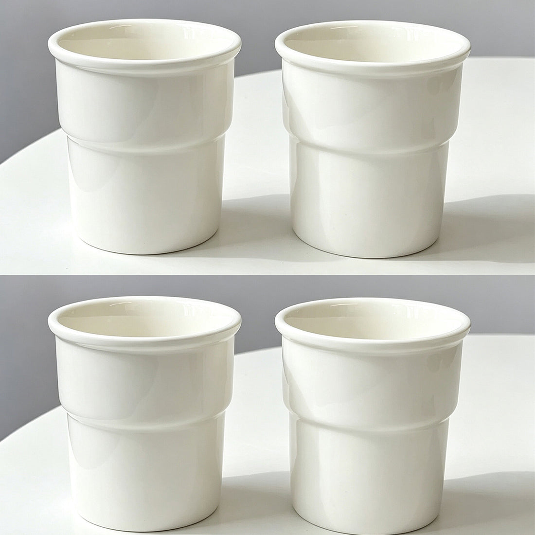 Hand holding a white ceramic cup
