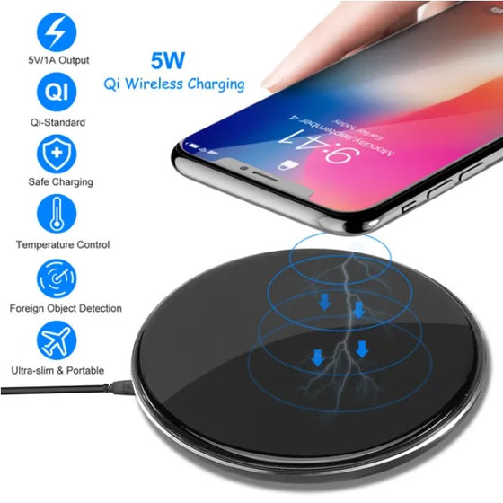 Phone placed on a black round wireless charging pad with feature icons