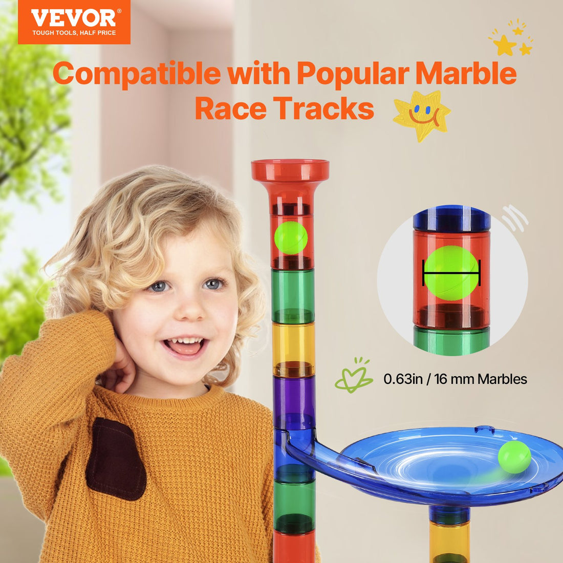 Boy playing with a marble run tower, takes 16 mm marbles