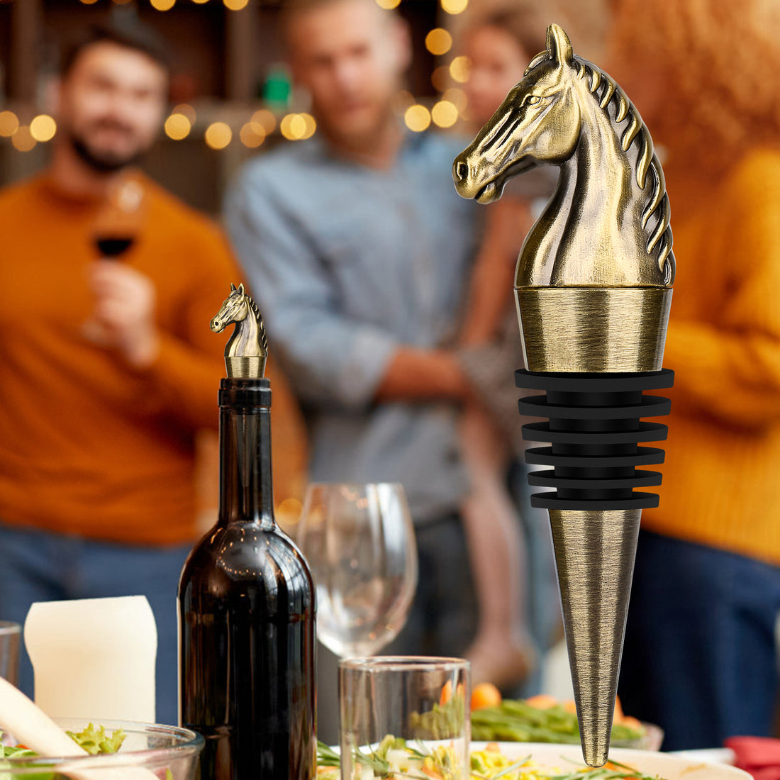 Bronze horse head wine stopper with friends toasting in the background