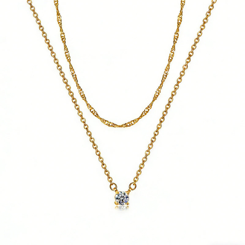 Gold-tone layered necklace set with twisted rope chain and single cubic zirconia pendant