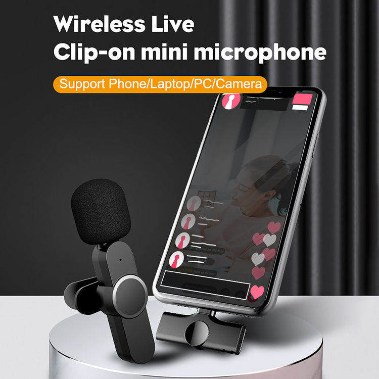 Wireless lapel clip microphone attached to a shirt collar