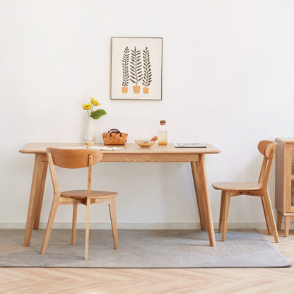 Wood dining chairs set staged for a meal