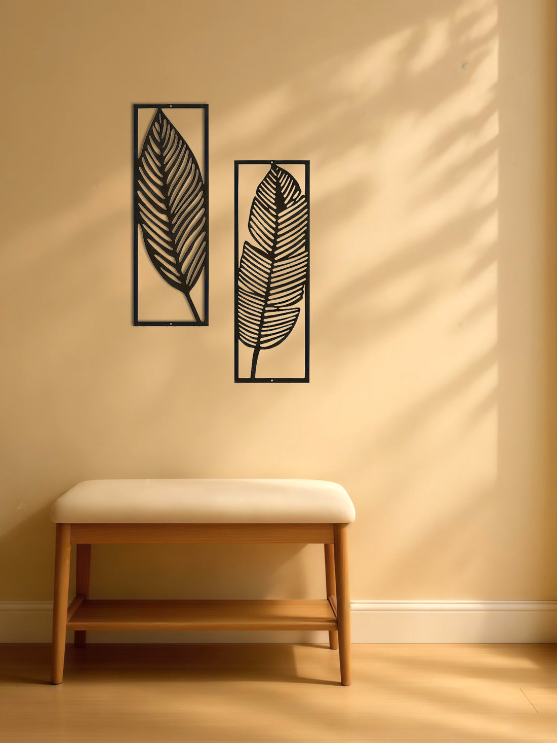 Leaf wall art panels above a wooden bench