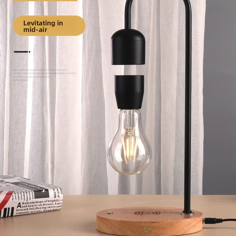Magnetic levitating LED light bulb floating above a black base, photo 3
