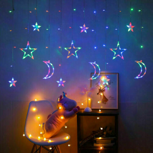 Multicolor star and moon LED curtain lights in a bedroom window