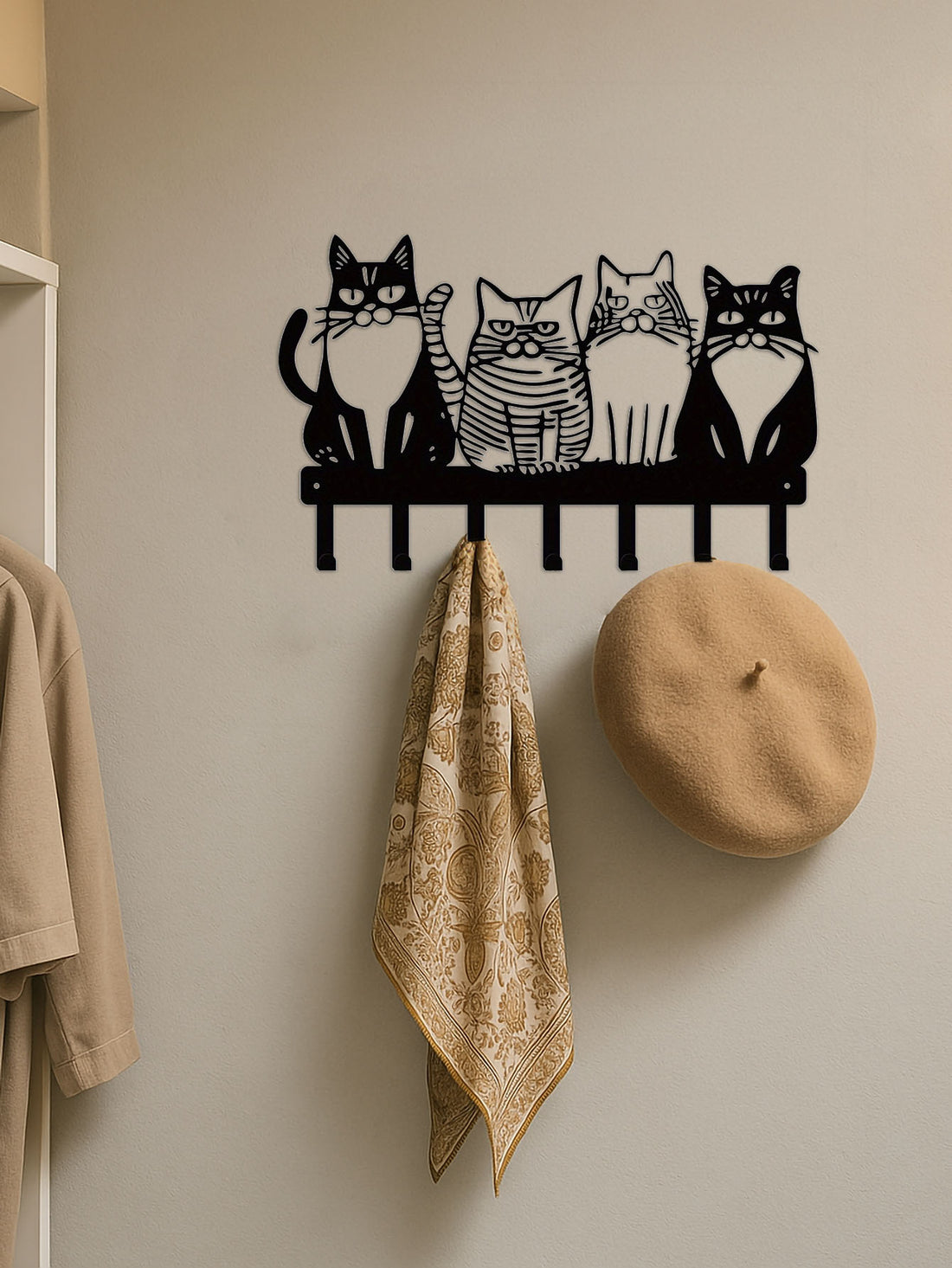 Cat wall hook rack holding a scarf and hat