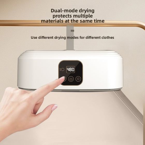 White dryer unit with a digital display touched by a finger