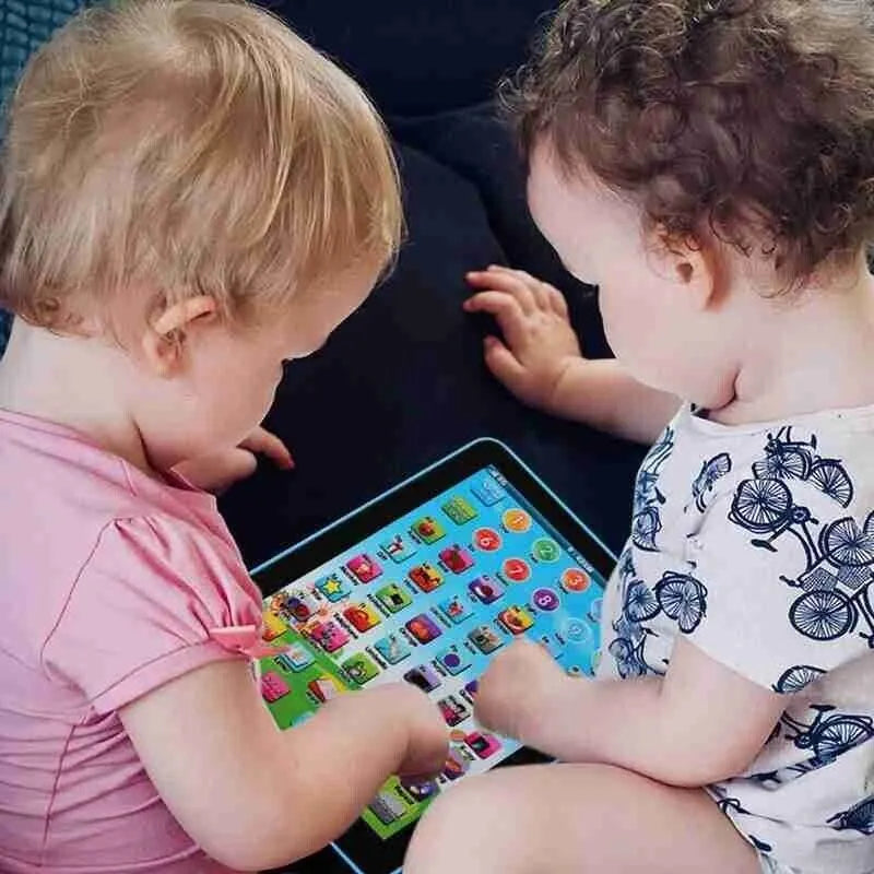 Two toddlers playing with the mini learning tablet together