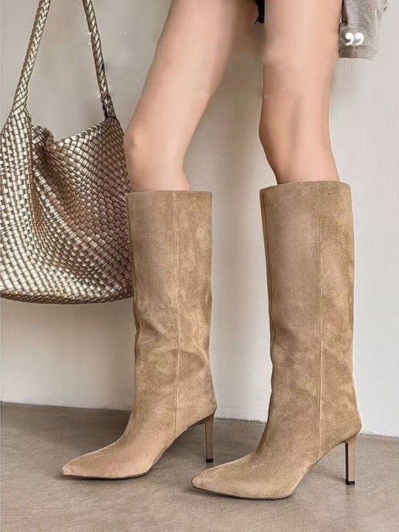Apricot suede pointed-toe stiletto boots worn with a woven bag