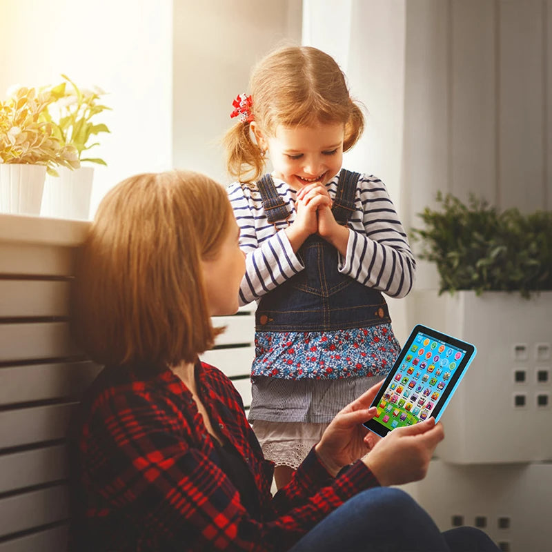 Two girls looking at the mini kids learning tablet by a window