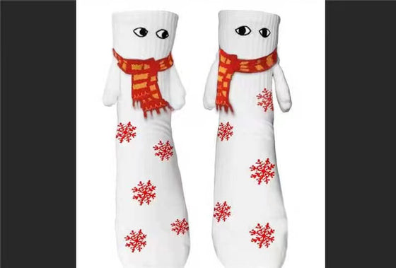 White Christmas socks with red scarves and magnetic hands