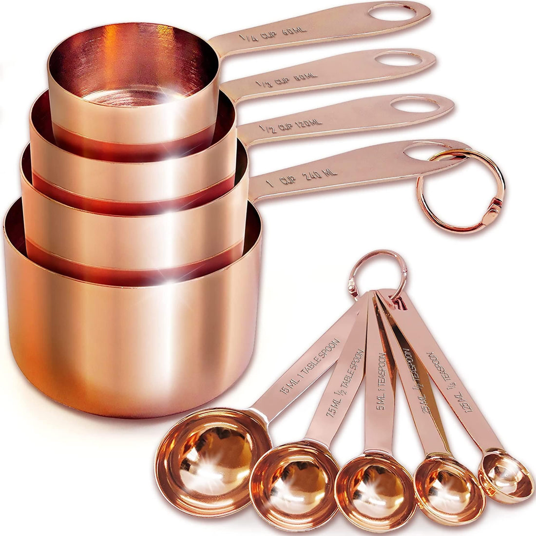 Rose gold stainless steel measuring cups and spoons with volume markings stamped into each handle
