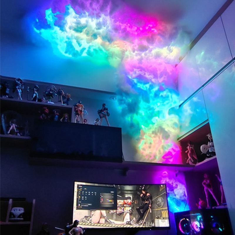 Rainbow cloud lamp spreading across the wall above a gaming desk