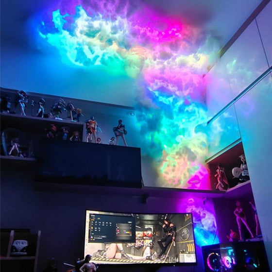 Rainbow cloud lamp spreading across the wall above a gaming desk