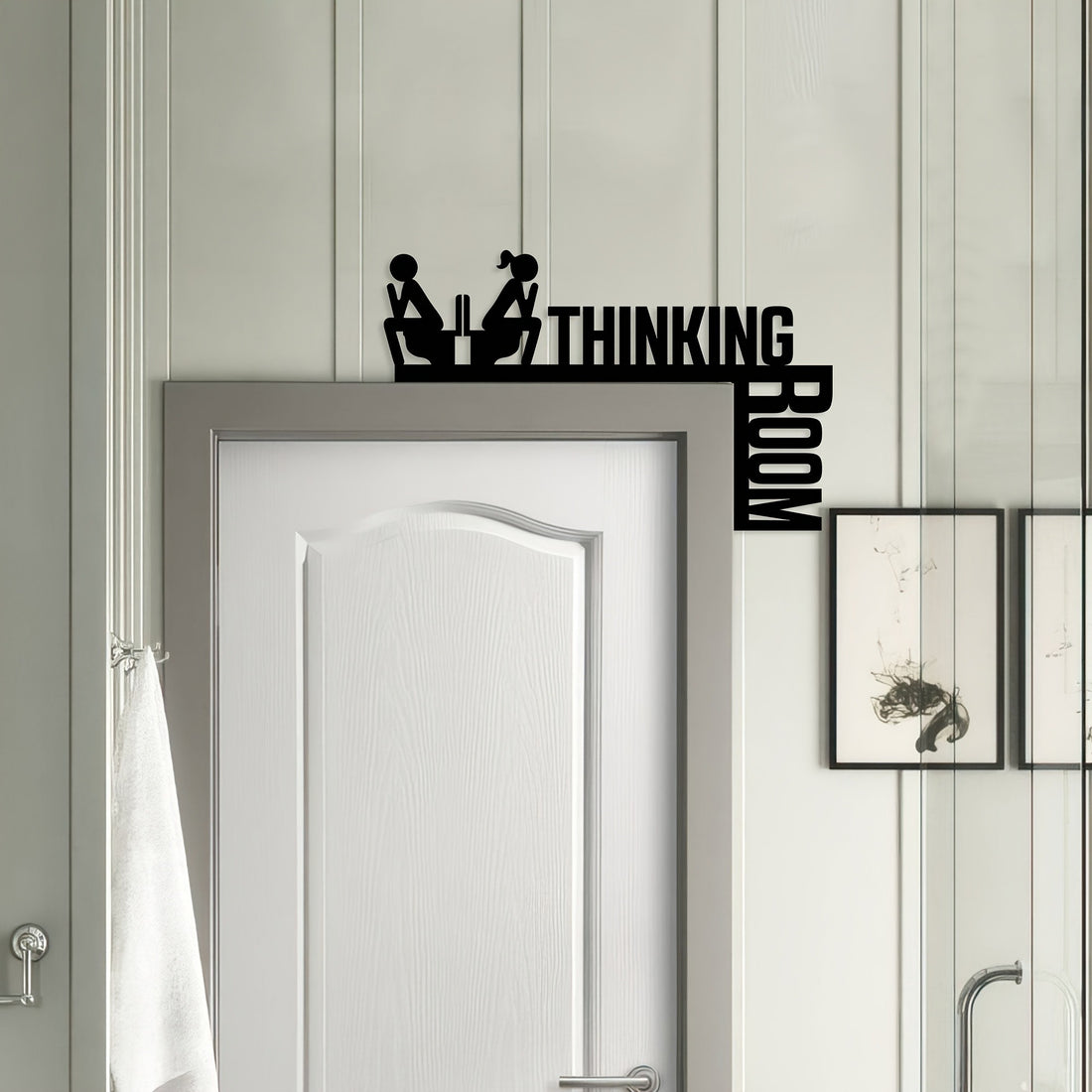 Thinking Room bathroom sign over a white door with toilet silhouette