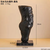Horse head sculpture weighted base close-up