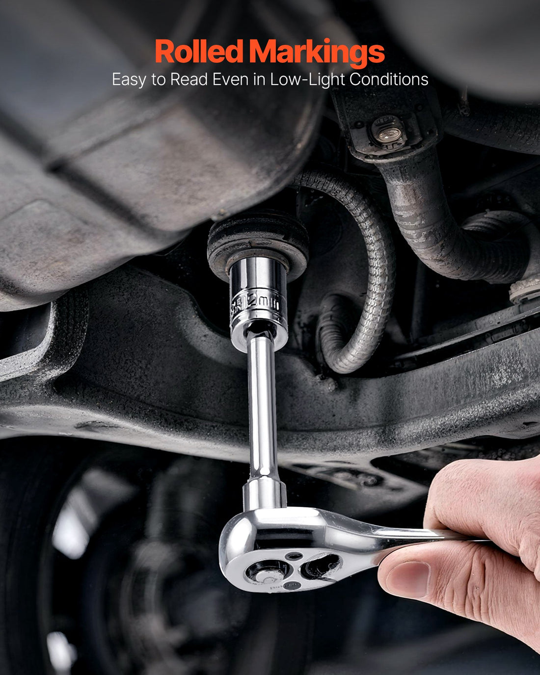 Ratchet and socket loosening a bolt on an engine