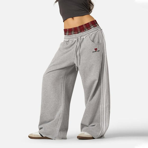 Gray wide-leg pants with a plaid waistband and side stripes