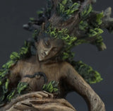 Tree spirit and bird sculpture detail closeup