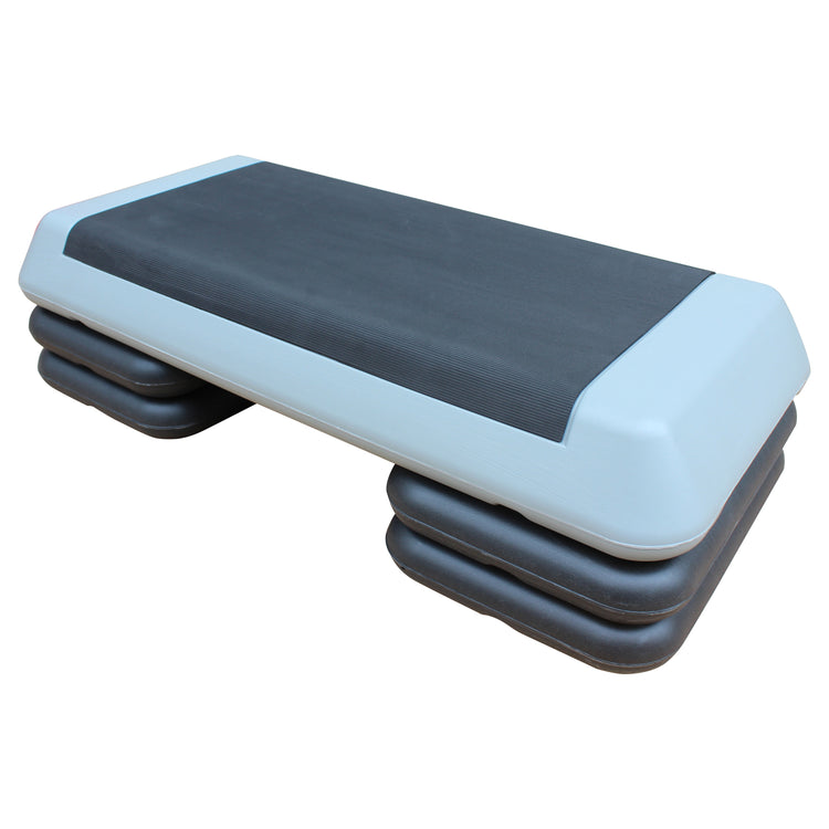Aerobic stepper with risers stored stacked beside the platform