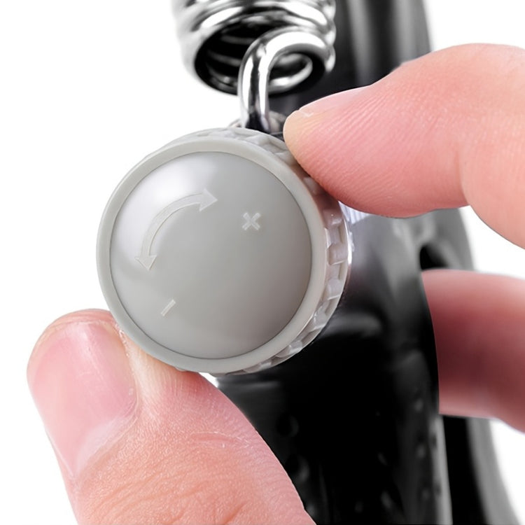 Grip strength trainer in use for forearm workout