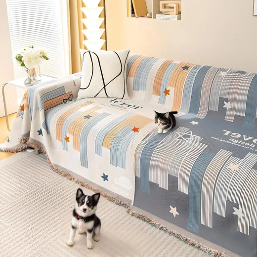 Gray anti-scratch sofa cover draped over a living room couch