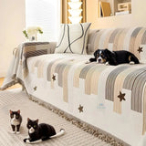 Sofa cover fitted over a two-seater loveseat
