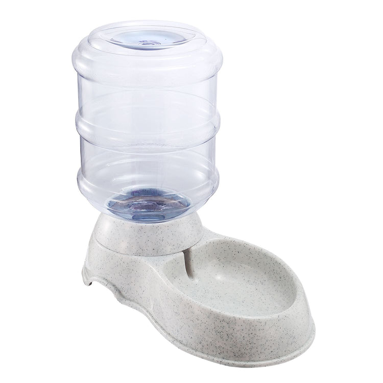 Inverted water bottle reservoir gravity-feeding into a speckled granite-look pet drinking basin
