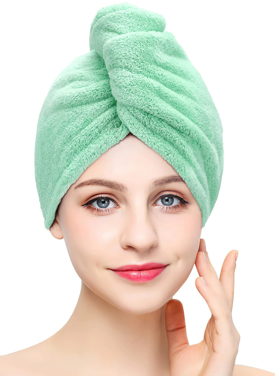 Light green coral fleece hair towel wrap worn on model with twist-and-tuck closure