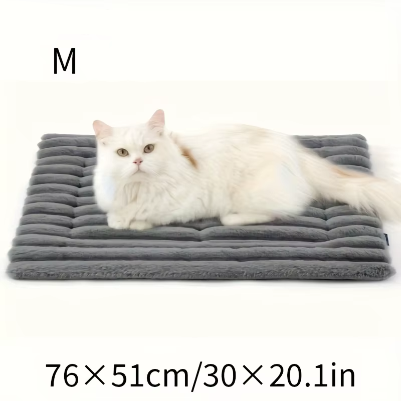 Soft dog bed mat with small dog lying on it