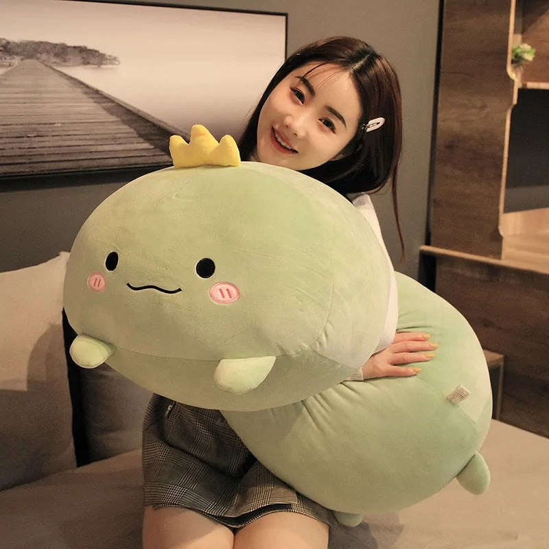 Plush animal being held to show its size relative to a hand