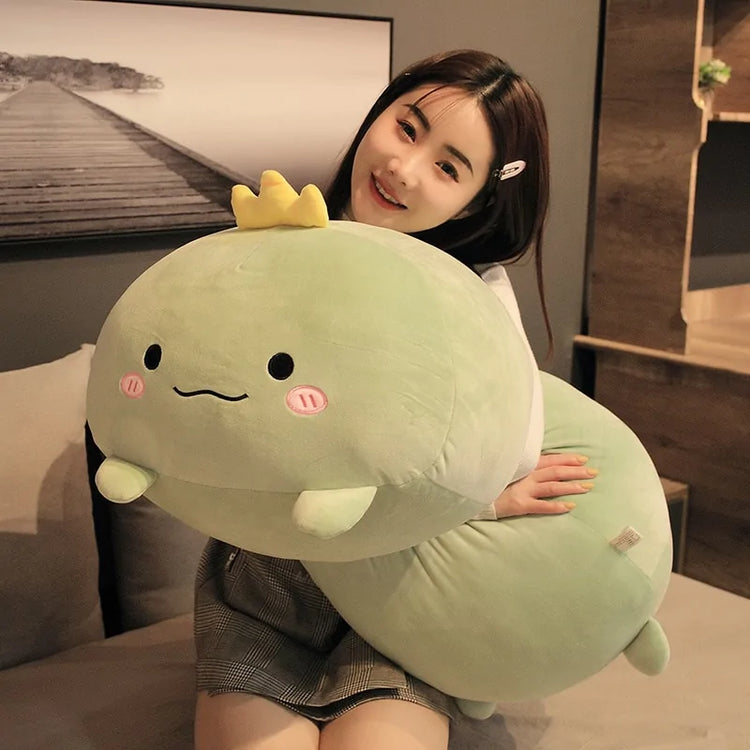 Plush animal being held to show its size relative to a hand