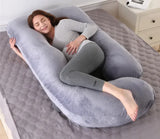 Detachable G-shaped velvet waist pillow shown against a chair back, its curved wings following the waist and lower back