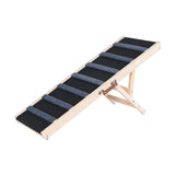 Small dog climbing dog ramp