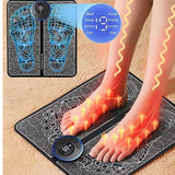 Black swirl-pattern EMS foot massage mat with printed foot outlines and a round mode-select remote
