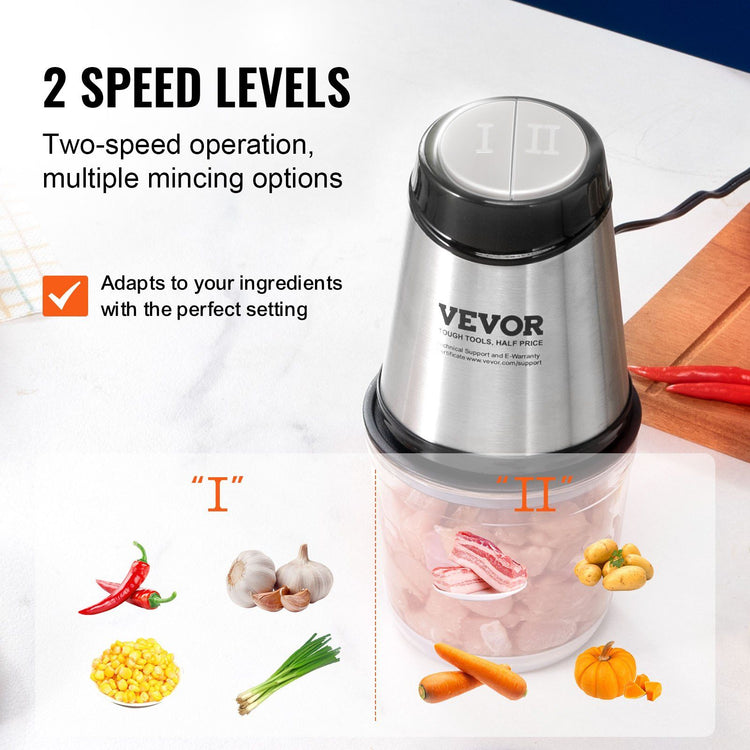 Food processor in use grinding meat in the glass bowl