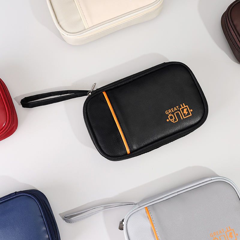Cable organizer pouch opened to show elastic loops and compartments