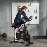 Red home exercise bike with adjustable seat and handlebars